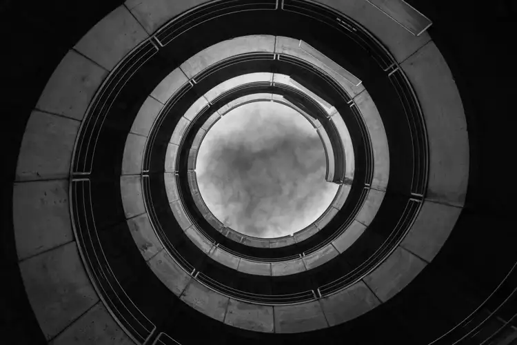 Spiral building looking up in greyscale