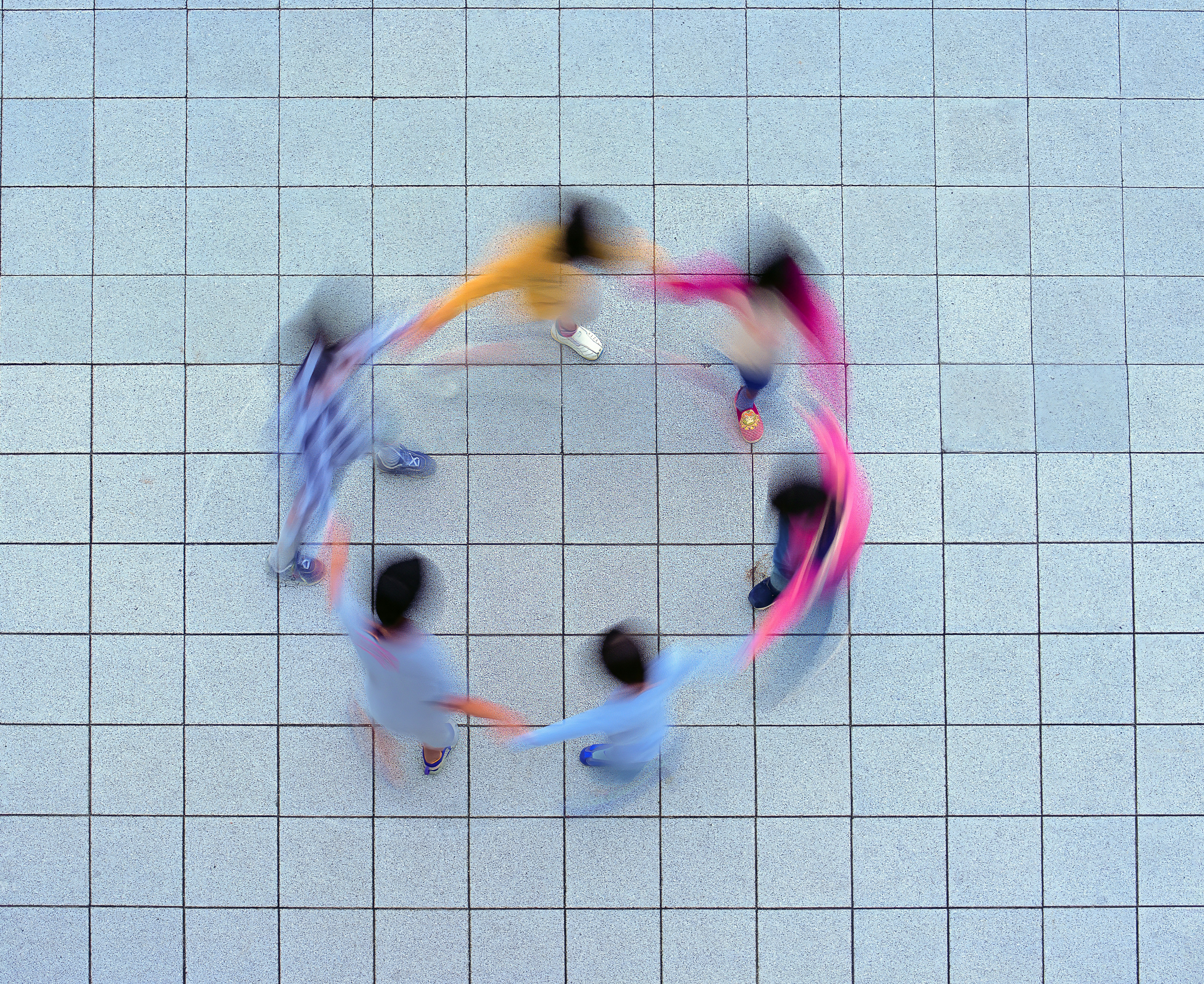 Group of people holding hands in a circle